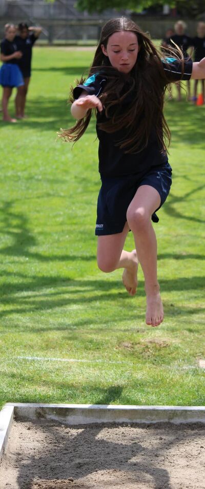 Student Midair During a Long Jump