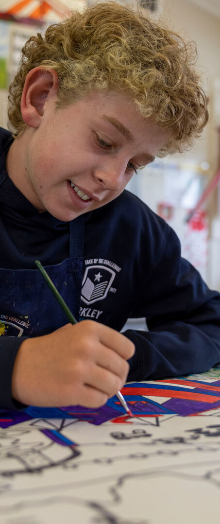 Student Paints a Colourful Geometric Artwork in Class