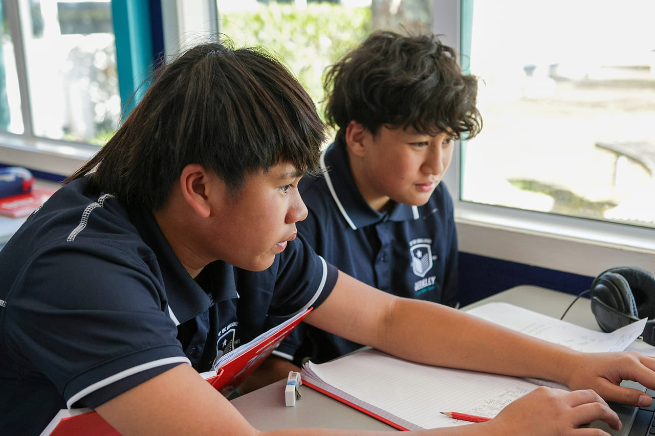 Two Berkley students working together in class
